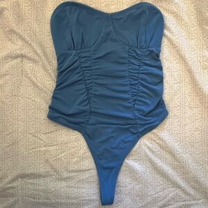 Out From Under blue bodysuit